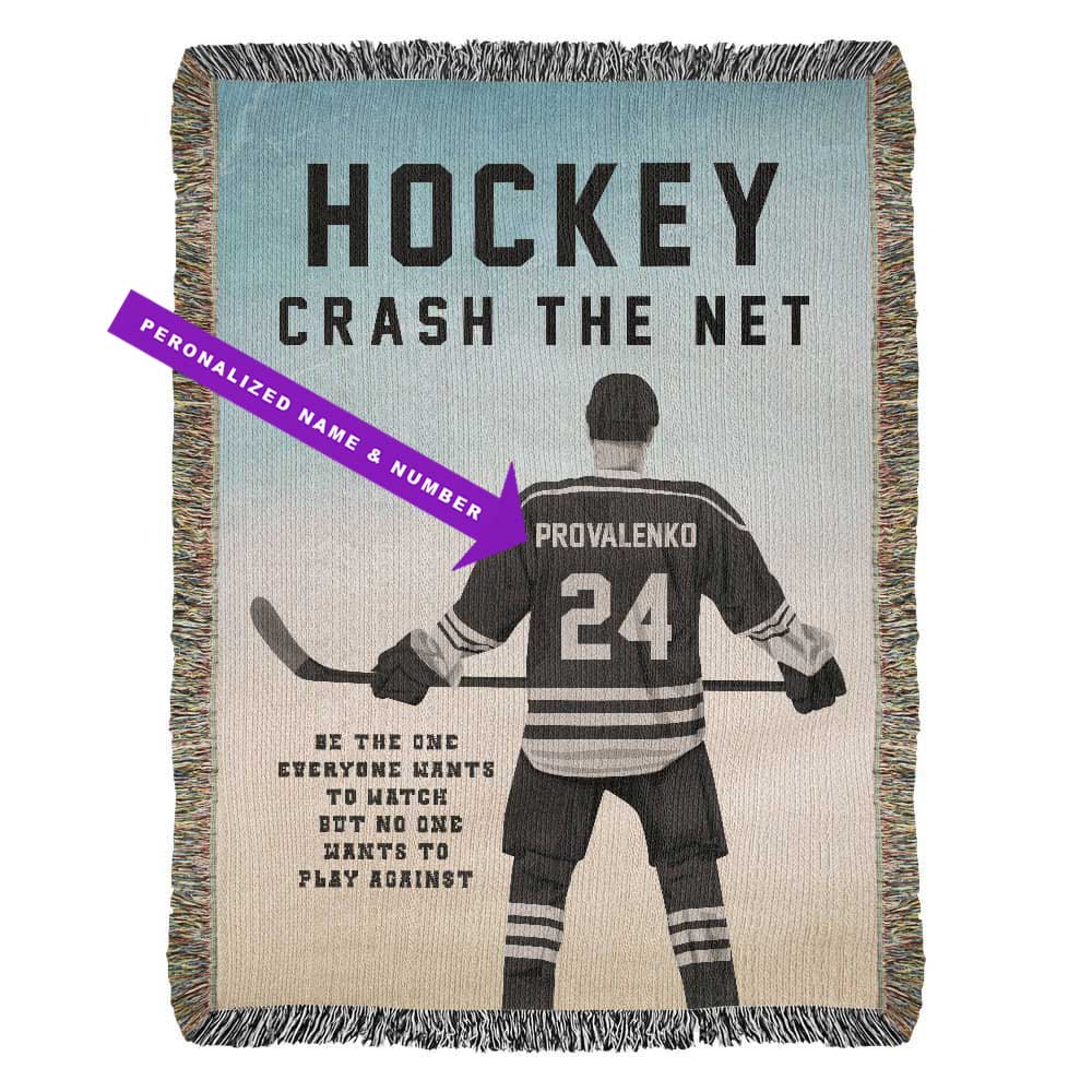 A personalized woven blanket with a hockey player in motion, the text 'HOCKEY CRASH THE NET' and customizable player name and jersey number, along with a motivational quote saying Be the one everyone wants to watch but no one wants to play against.