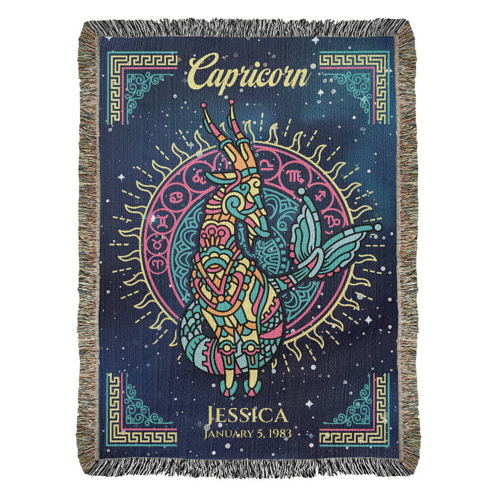 A personalized woven blanket with a Capricorn zodiac sign design, featuring a goat, and personalized text including a name and dates.