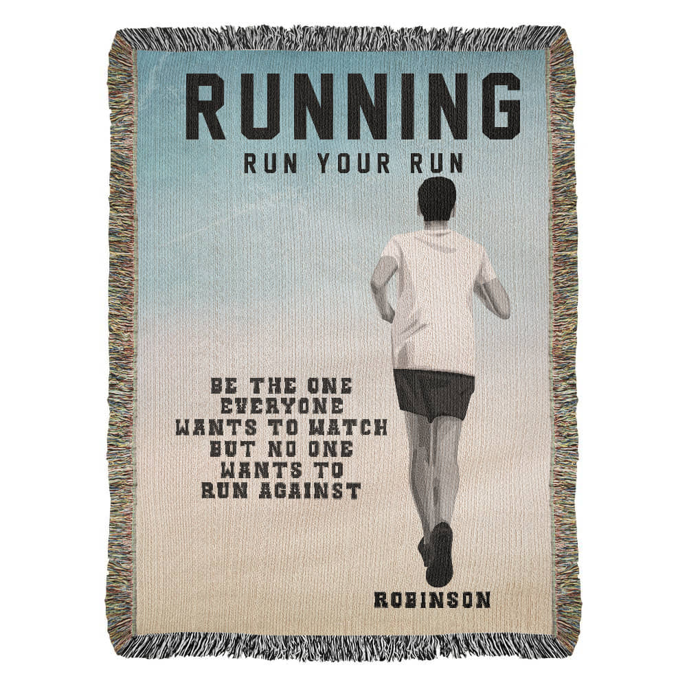 A personalized woven blanket with a runner in motion on the front and the text 'RUNNING Run Your Run BE THE ONE EVERYONE WANTS TO WATCH BUT NO ONE WANTS TO RUN AGAINST. Runner name Robinson is customizable.