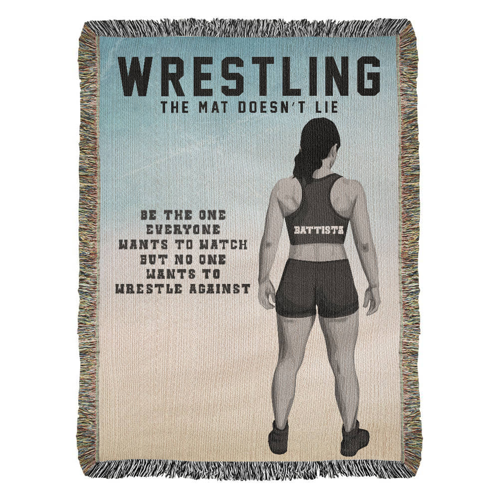A woven blanket with a rear-view illustration of a female wrestler, featuring a custom name across the back, with the text 'WRESTLING', 'THE MAT DOESN'T LIE', and 'BE THE ONE EVERYONE WANTS TO WATCH BUT NO ONE WANTS TO WRESTLE AGAINST'.