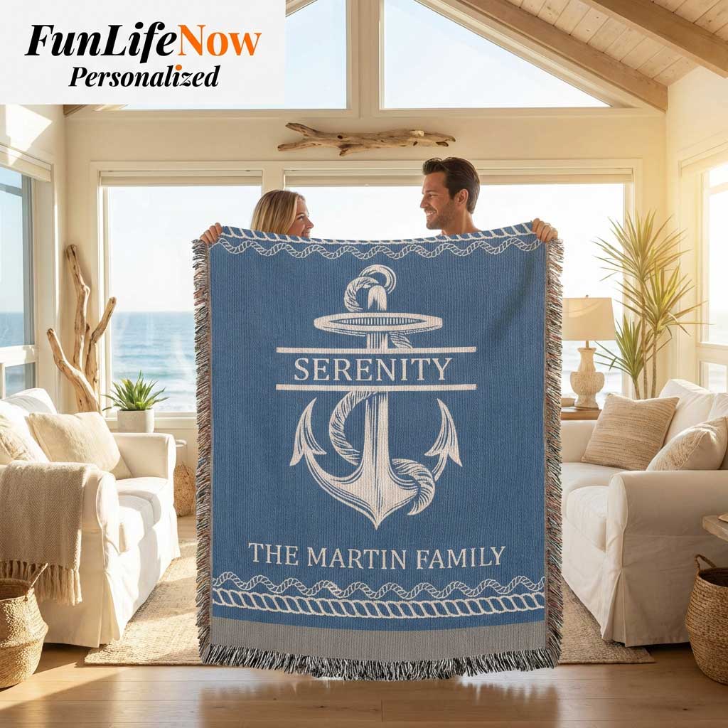 Two people holding a personalized nautical boating blanket with an anchor design and custom text in a living room. Blanket available at funlifenow.com