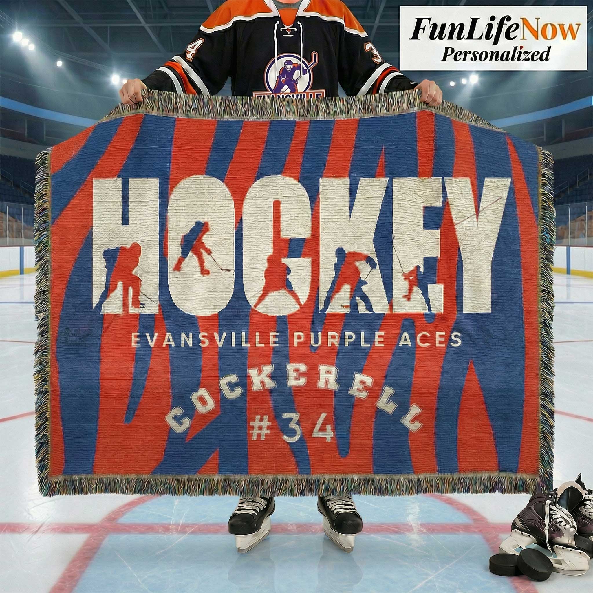 Person holding a hockey-themed blanket with 'Evansville Purple Aces' and 'Cockerell #34' on an ice rink.