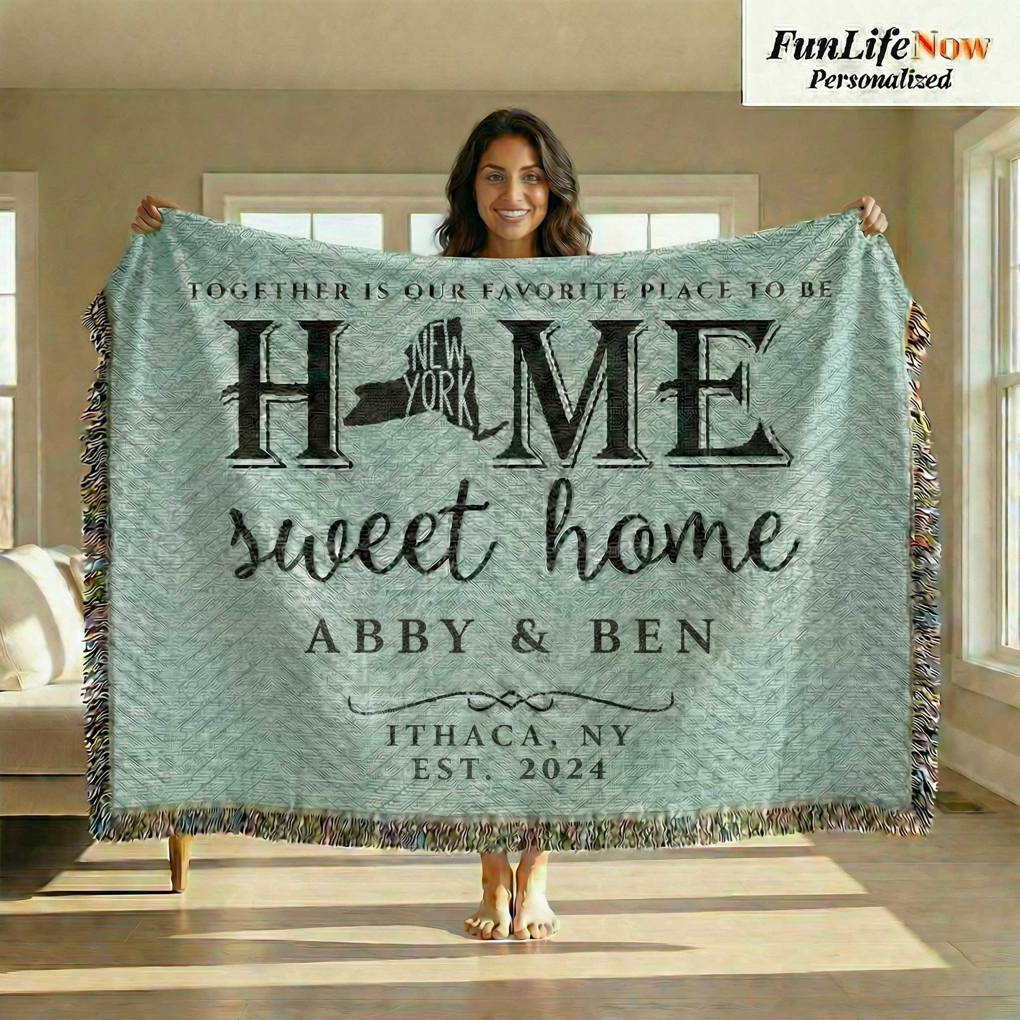Person holding a personalized New York State blanket with 'Home sweet home' and customized text and names in a room. Blanket available at funlifenow.com