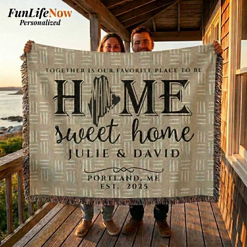 Person holding a Maine state 'Home sweet home' blanket with personalized text against a scenic backdrop. Blanket available at funlifenow.com