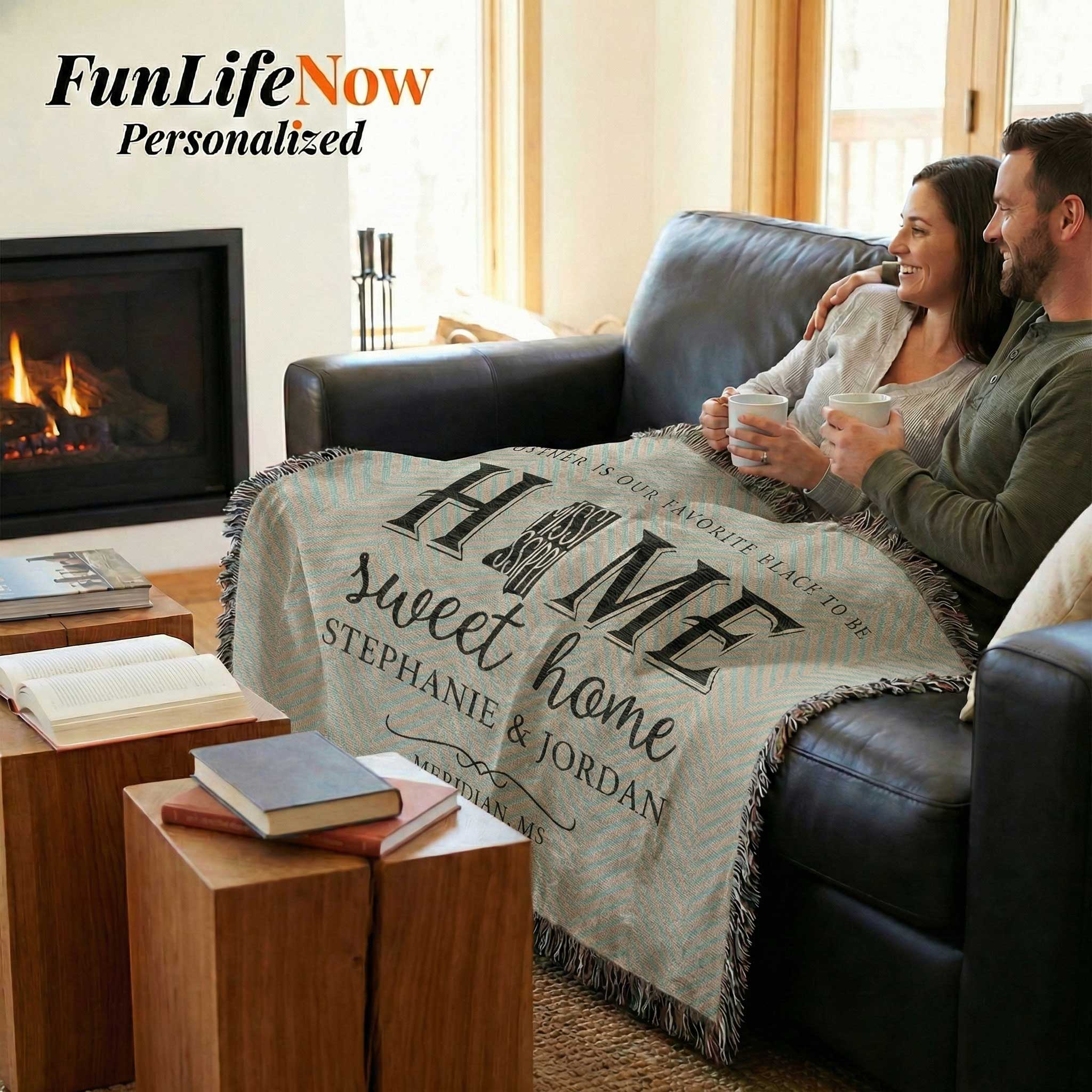 Couple holding a personalized 'Home Sweet Home' blanket in a cozy living room. Personalized Mississippi blanket available at funlifenow.com