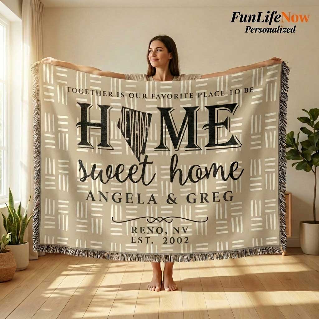 Two people holding a Nevada State blanket with personalized text in a desert setting. Blanket available at funlifenow.com