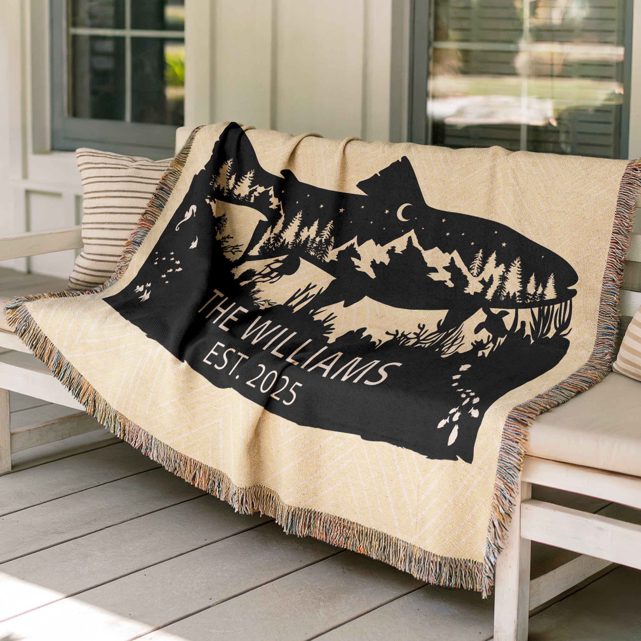 Personalized Woven Blanket with nature fish design and monogramed name with Est. year. Blanket on patio bench outdoors.Available at FunLifeNow.com