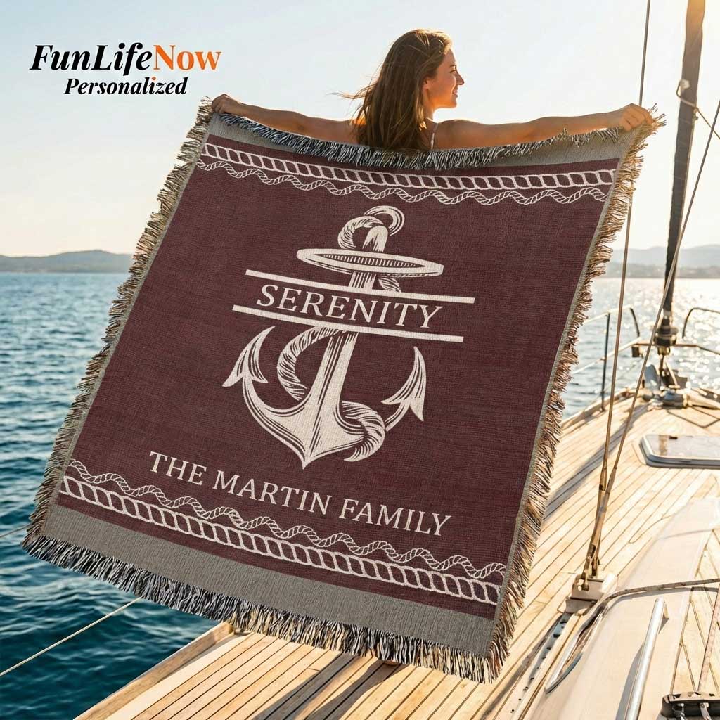 Two people holding a personalized nautical boating blanket with an anchor design and custom text in a living room. Blanket available at funlifenow.com