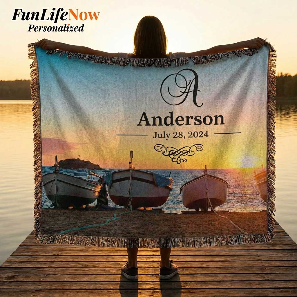 Person holding a personalized nautical boating blanket with a sunset and boats design, featuring the name 'Anderson' and date. Custom blanket is available at funlifenow.com