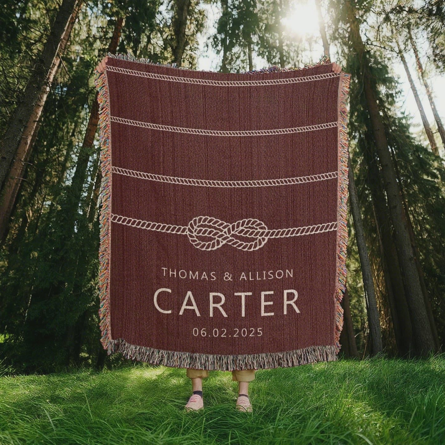 A personalized woven blanket with a nautical rope design, featuring custom text that includes couple's names and a special date, displayed on a maroon background with fringe. Available at funlifenow.com