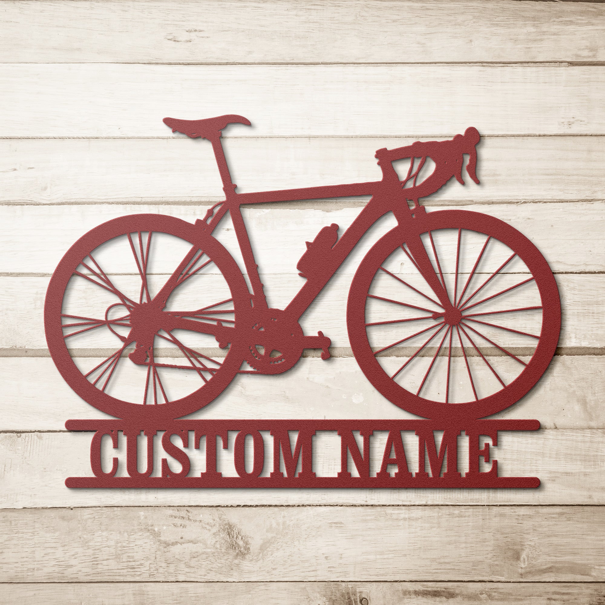 Personalized metal art sign in the shape of a racing bicycle with a custom name space.